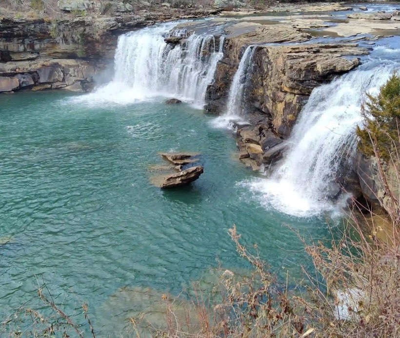 A sandstone canyon with a river running through its floor.